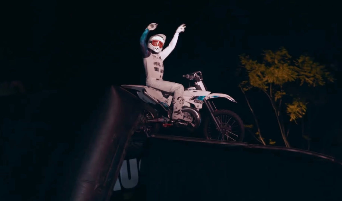 Pat Bowden raising his arms on his motorcycle after the X-Class launch performance