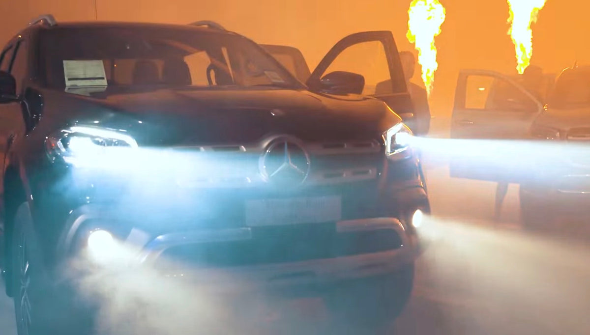Front view of the Mercedes-Benz X-Class with headlights and flame effects