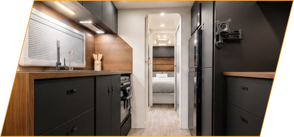 Kitchen bench and cupboards looking through the caravan interior