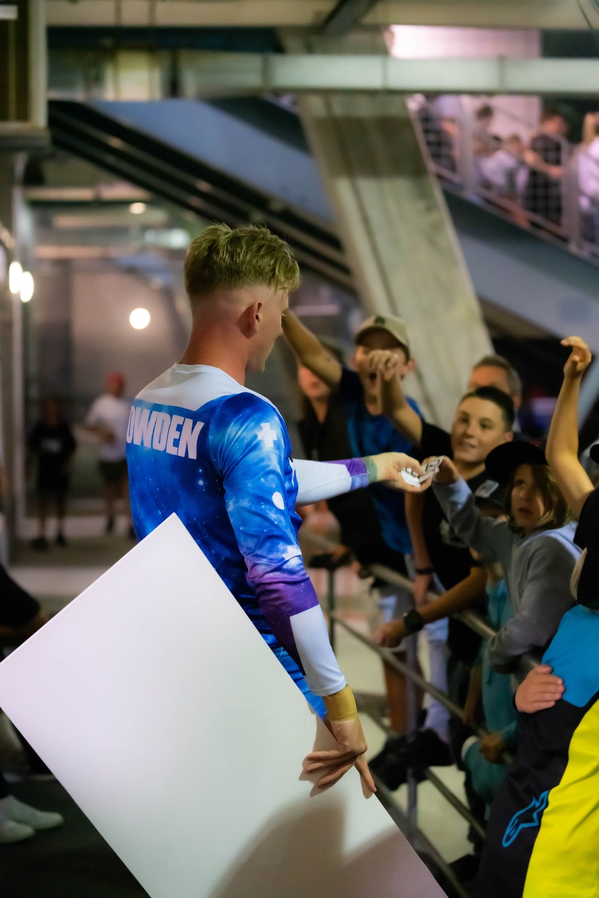 Pat signing autographs for young fans