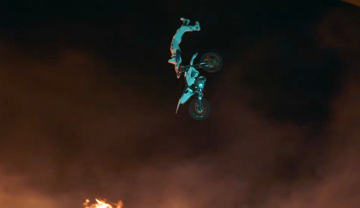 Pat Bowden extending above his motorcycle during the Mercedes-Benz launch performance