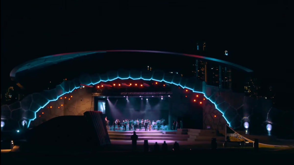 Wide night view of the illuminated Mercedes-Benz X-Class launch venue