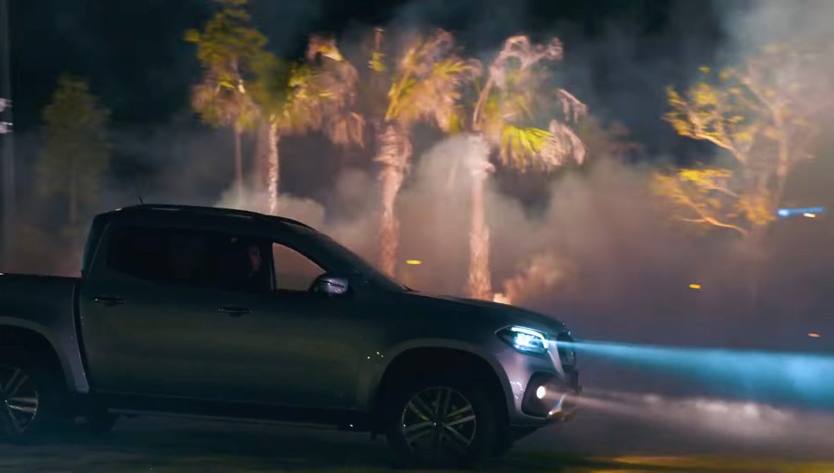 Side view of the Mercedes-Benz X-Class at the illuminated launch
