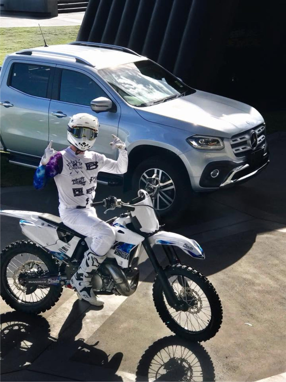 Pat Bowden on his Mercedes-Benz-branded motorcycle beside an X-Class